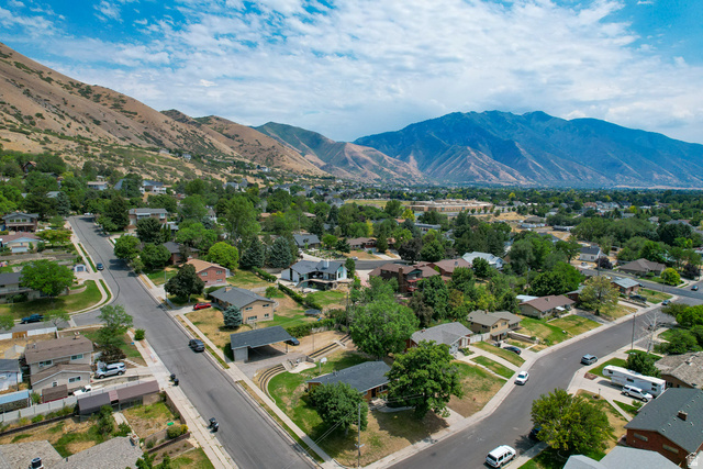 120 North 1230 E Street Springville, UT 84663 - Photo 48 of 60 Residential neighborhood with paved streets and mature trees, set against a backdrop of mountains