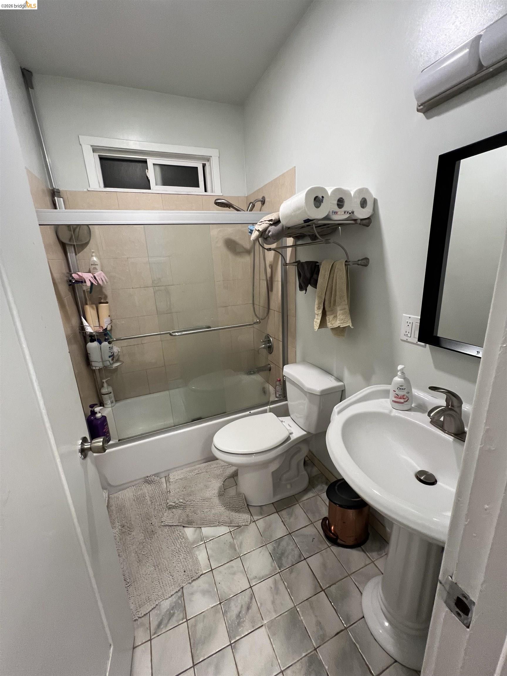 2214 Durant Avenue, Unit 5 Berkeley, CA 94704 - Photo 8 of 8 a bathroom with a toilet a sink and mirror