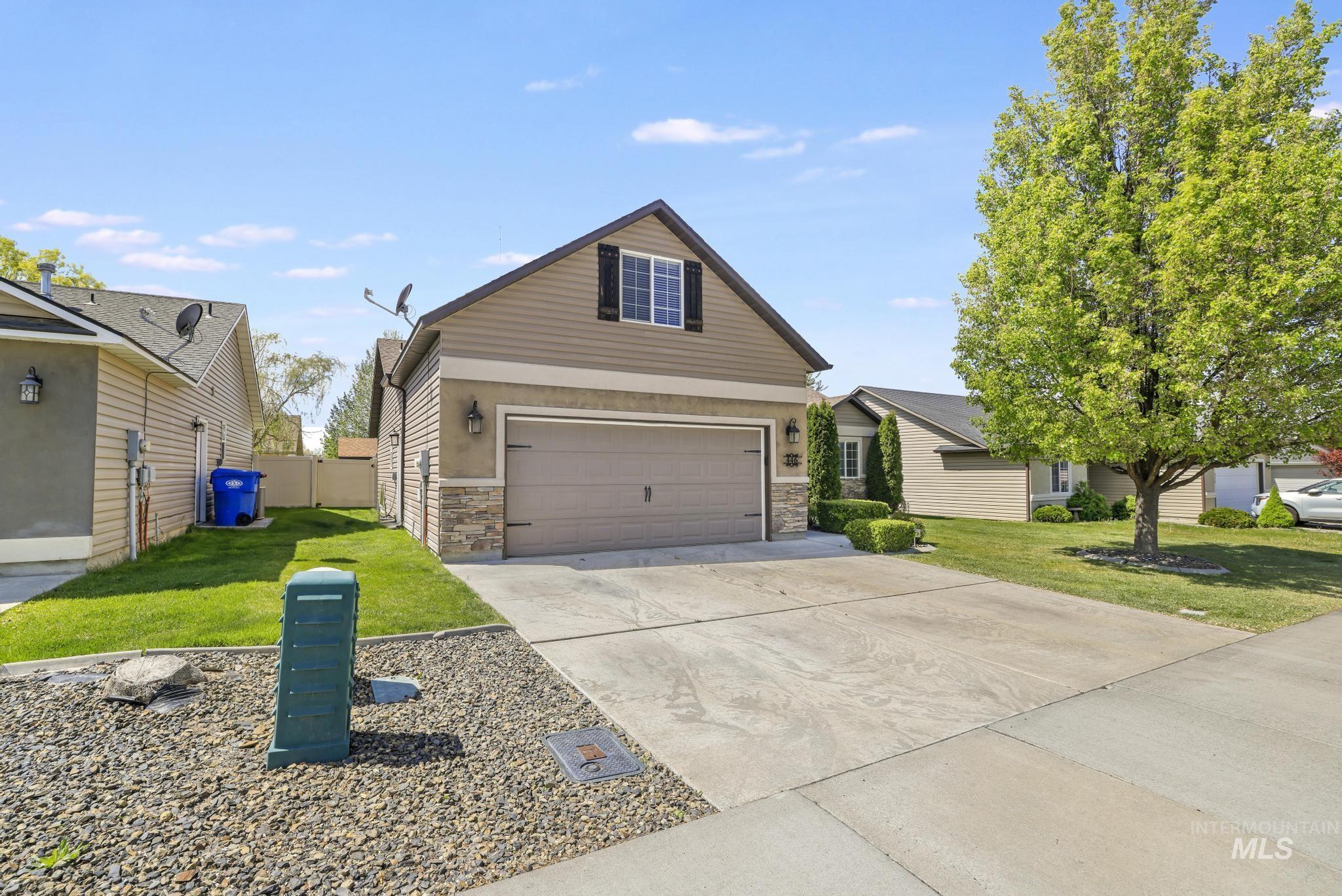 446 Noble Street Twin Falls, ID 83301 - Photo 28 of 42 Two-story home featuring a two-car garage with carriage-style doors