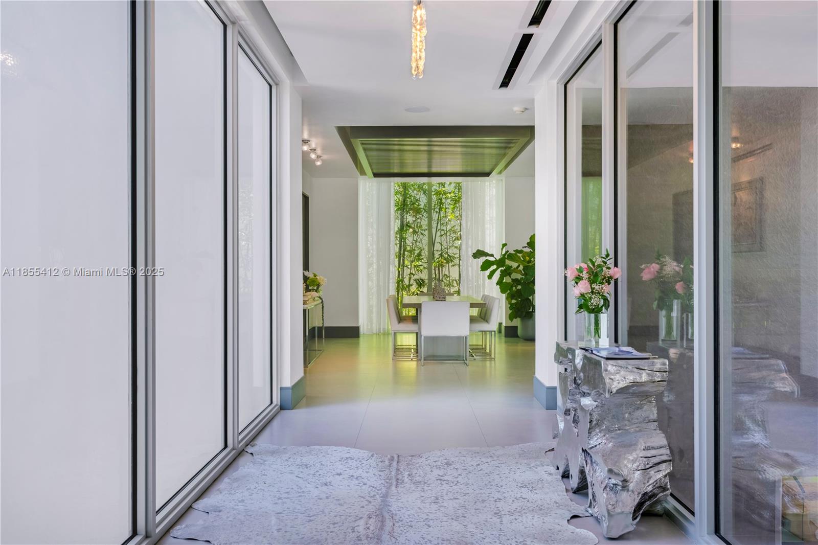 545 Sabal Palm Drive Key Biscayne, FL 33149 - Photo 17 of 100 a lobby with furniture and floor to ceiling window