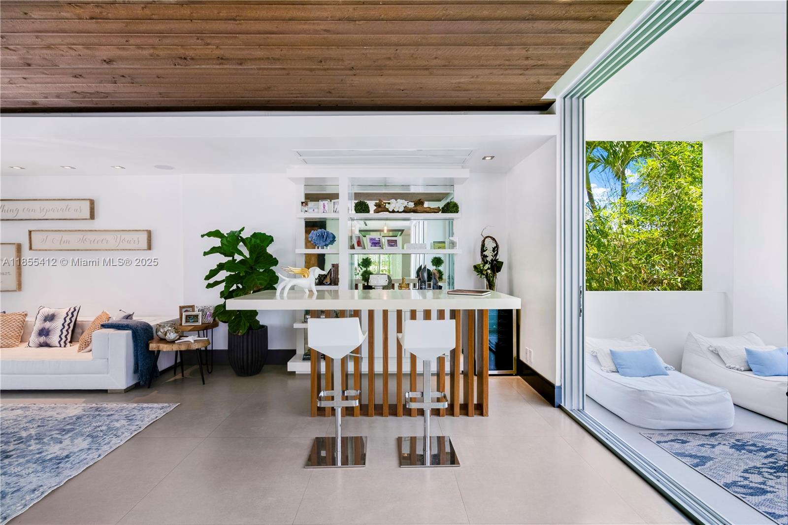 545 Sabal Palm Drive Key Biscayne, FL 33149 - Photo 19 of 100 a dining room with furniture and a floor to ceiling window