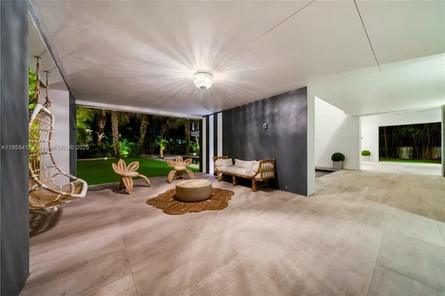 a view of living room kitchen with furniture and outdoor view