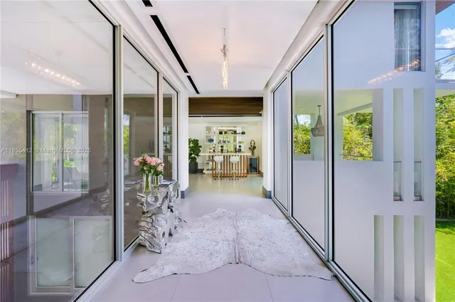 a bathroom with sink a mirror and toilet