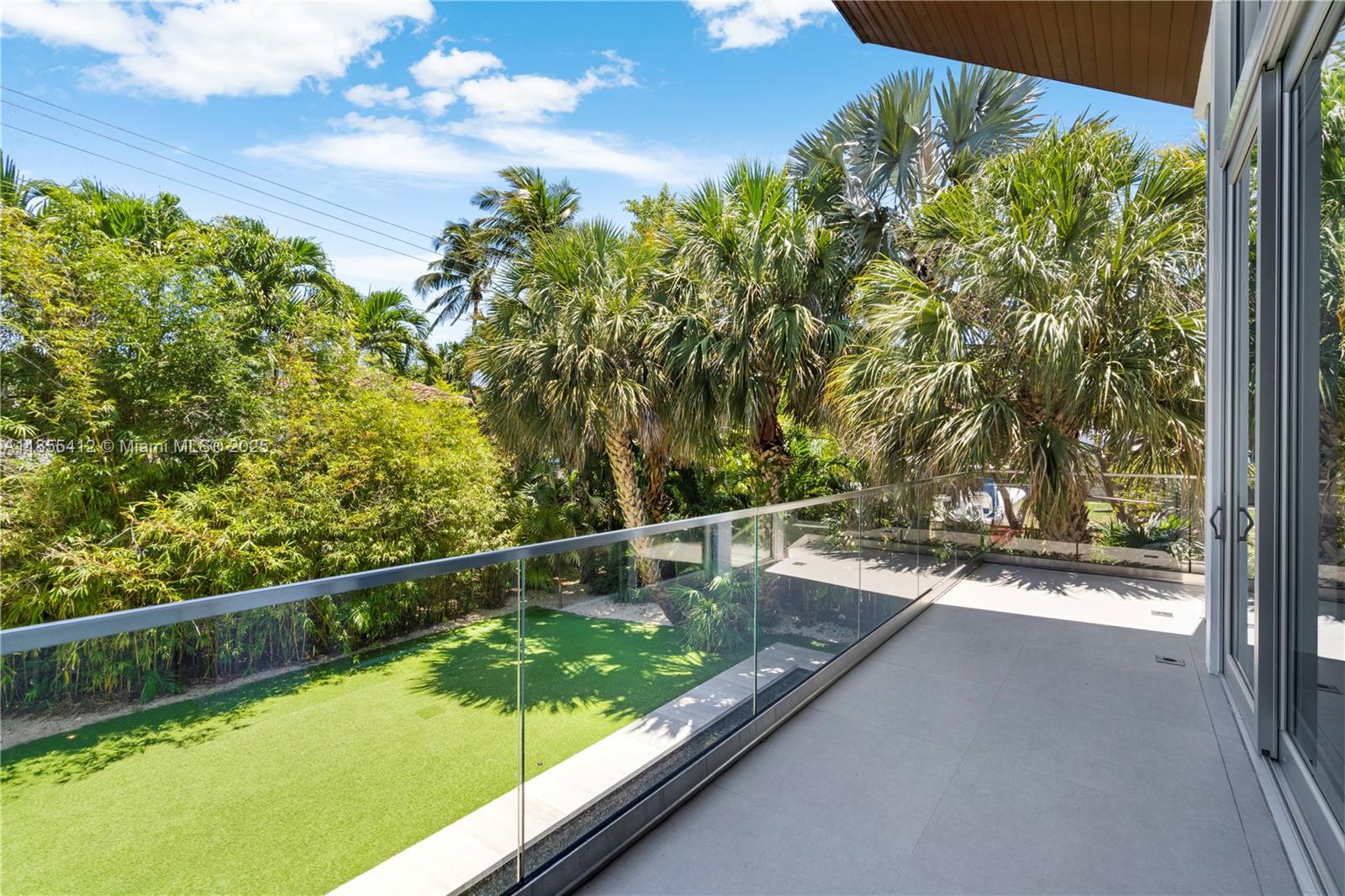 545 Sabal Palm Drive Key Biscayne, FL 33149 - Photo 35 of 100 a view of a swimming pool with a outdoor seating