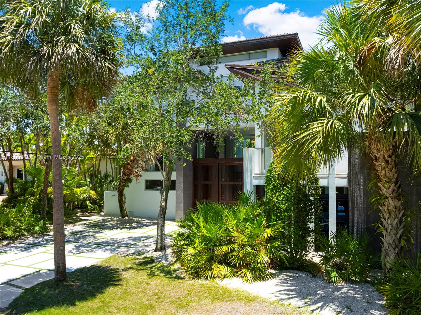 545 Sabal Palm Drive Key Biscayne, FL 33149 - Photo 37 of 100 a view of a house with a yard