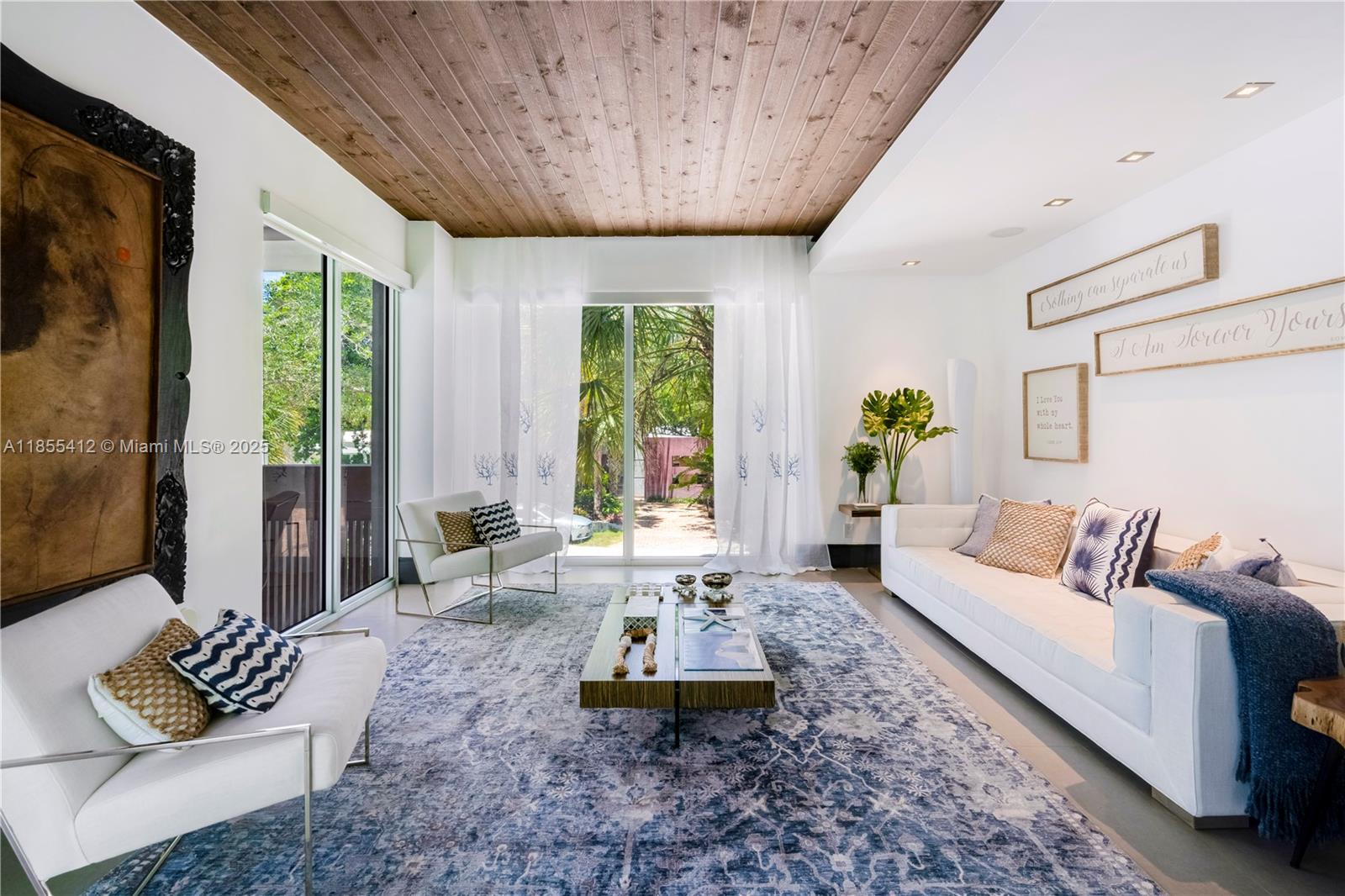 545 Sabal Palm Drive Key Biscayne, FL 33149 - Photo 43 of 100 a living room with furniture and a large window