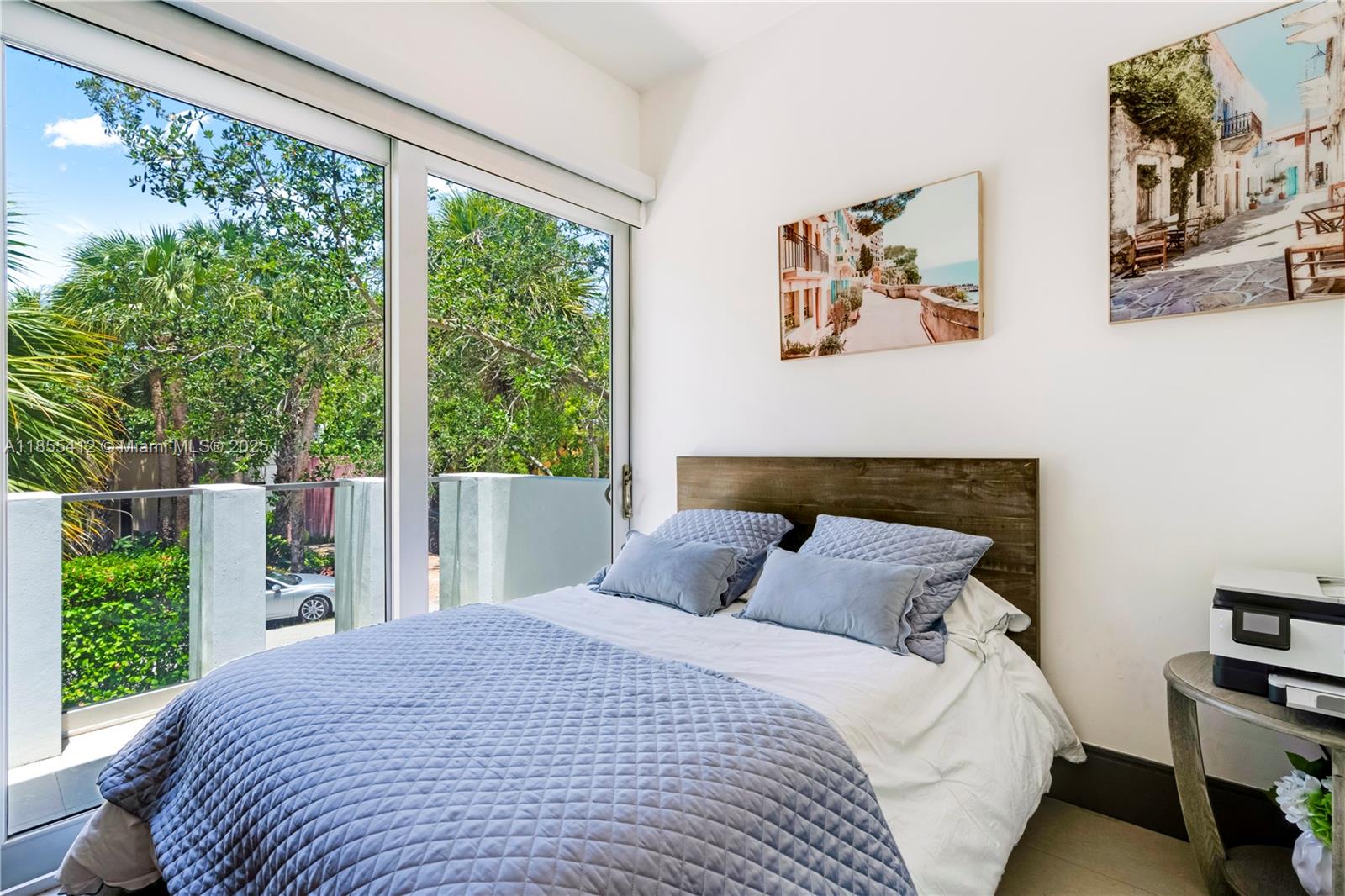 545 Sabal Palm Drive Key Biscayne, FL 33149 - Photo 44 of 100 a bedroom with a large bed and a window