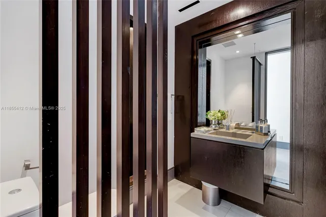 a view of a house with a tree in front of it