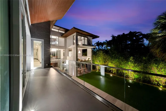 a spacious bedroom with a bed and a chandelier
