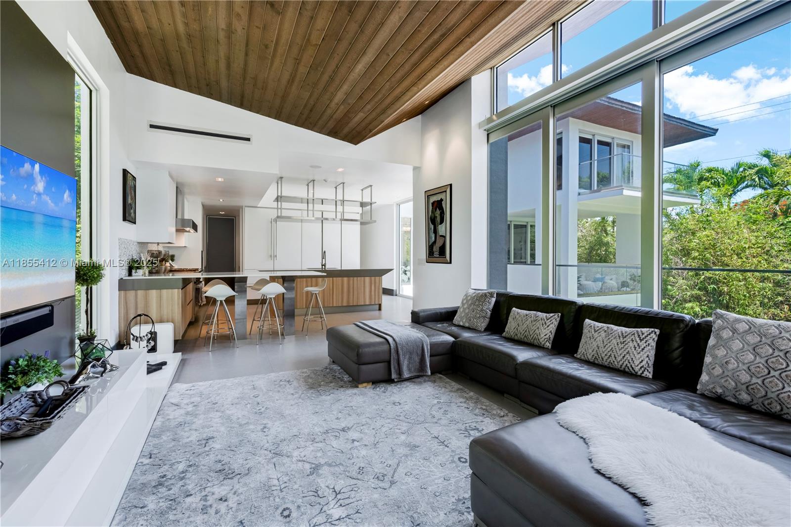 545 Sabal Palm Drive Key Biscayne, FL 33149 - Photo 65 of 100 a living room with furniture and a large window