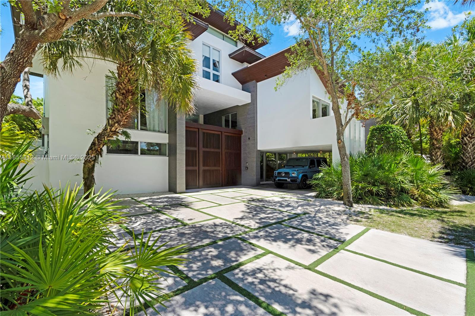 545 Sabal Palm Drive Key Biscayne, FL 33149 - Photo 9 of 100 a view of a house with a patio