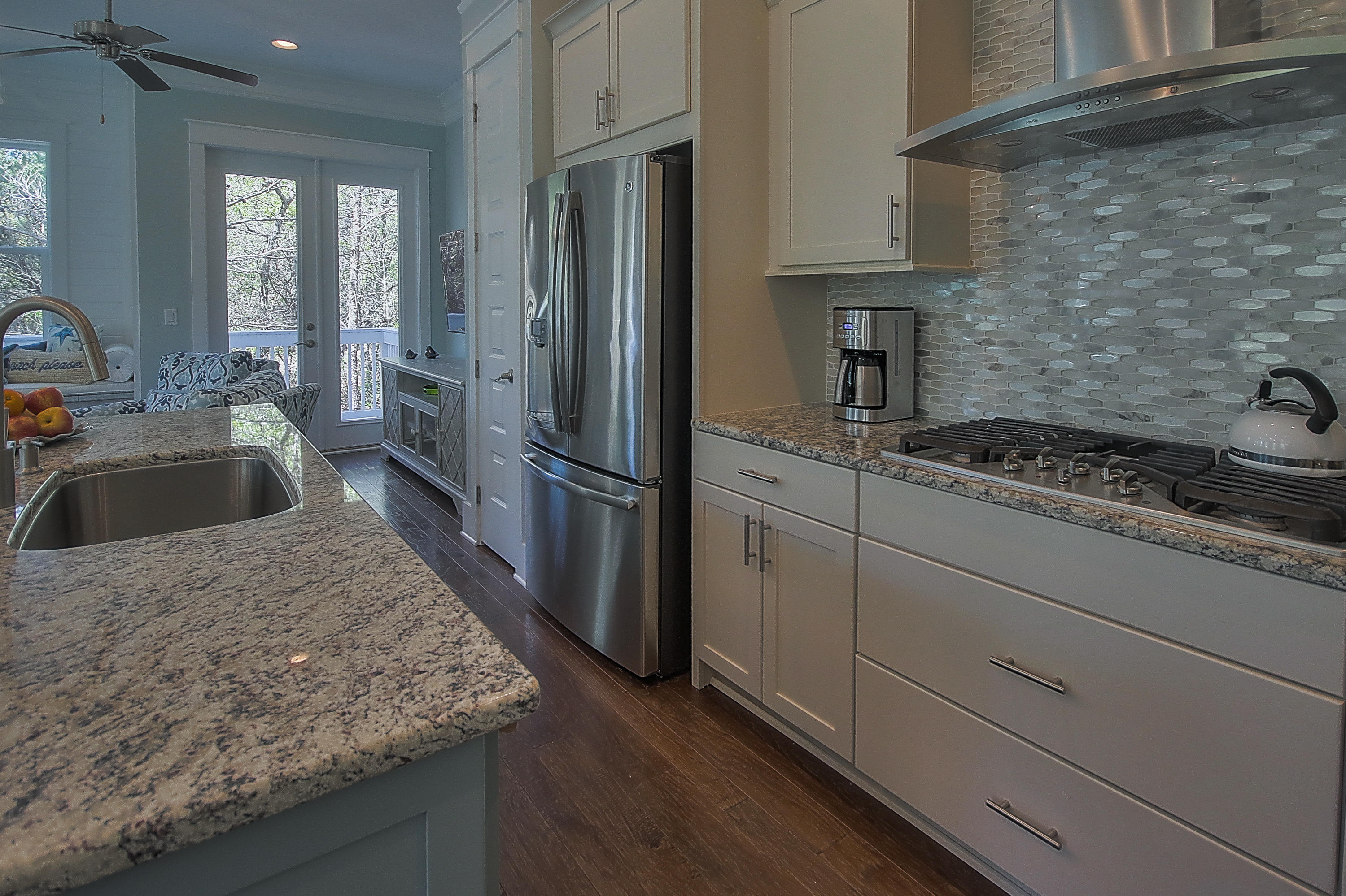 167 Milestone Drive, Unit A Inlet Beach, FL 32461 - Photo 6 of 47 a kitchen with granite countertop a sink stove and refrigerator
