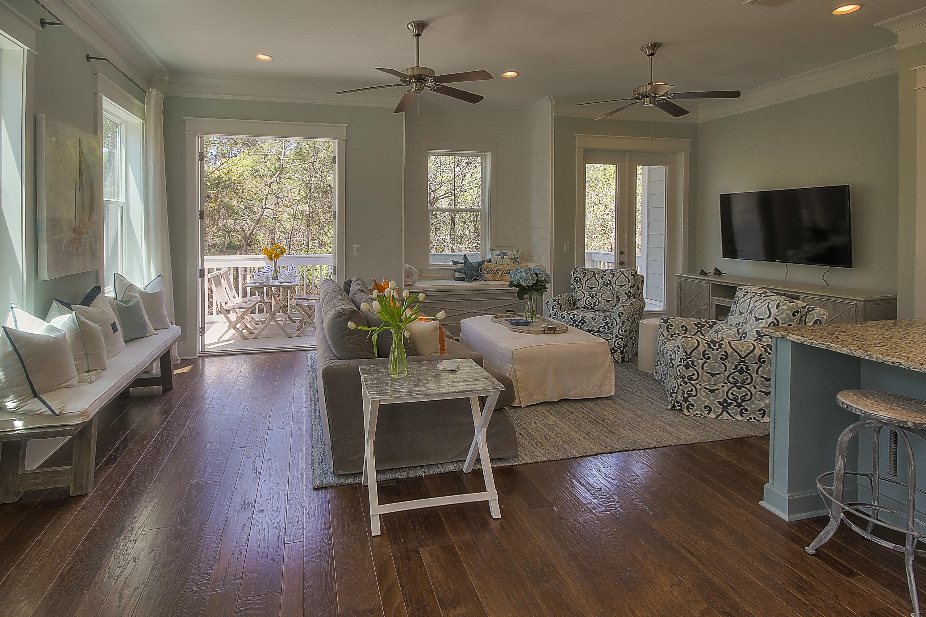 167 Milestone Drive, Unit A Inlet Beach, FL 32461 - Photo 10 of 47 a living room with furniture a flat screen tv and a large window