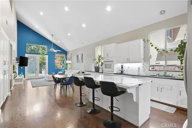 a kitchen with lots of counter top space and dining table