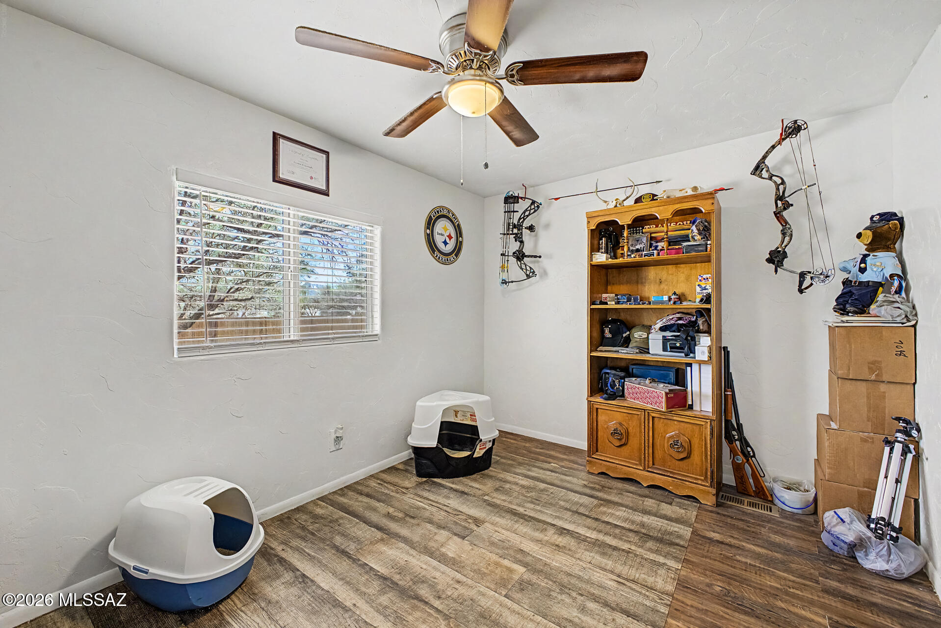 4231 East Pinal Street Tucson, AZ 85739 - Photo 12 of 36 a bedroom with furniture and a window