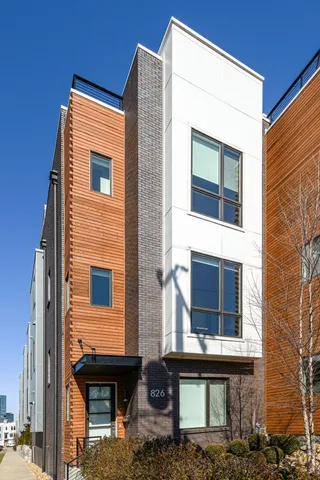 a front view of a house with glass windows