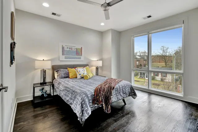 a bedroom with bed and a window