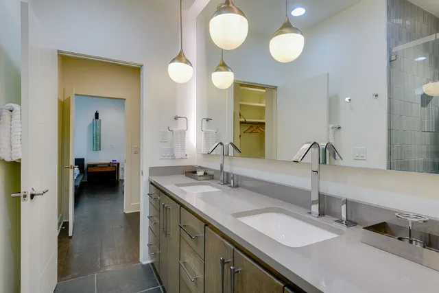 a bathroom with a glass shower door