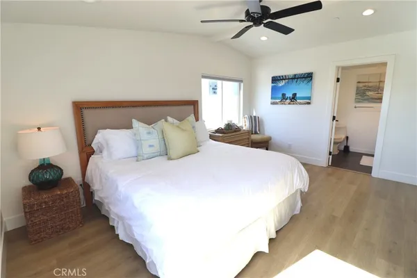 a bedroom with bed and a window