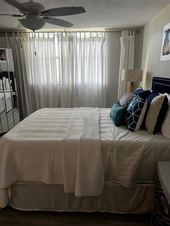 9070 Lime Bay Boulevard, Unit 209 Tamarac, FL 33321 - Photo 14 of 27 a bedroom with a bed and a window