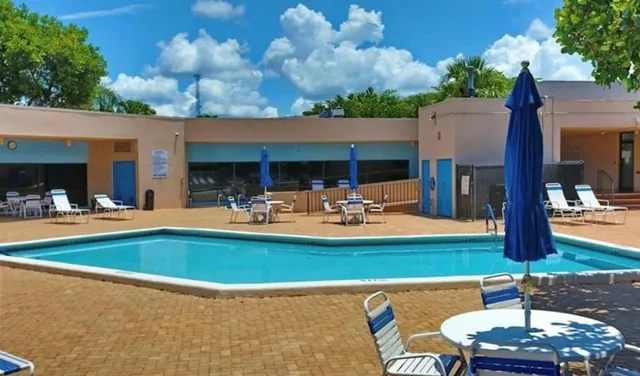 an aerial view of a houses with ocean view