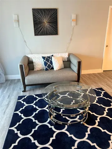 a living room with a black white checkered floor with a black white checkered floor