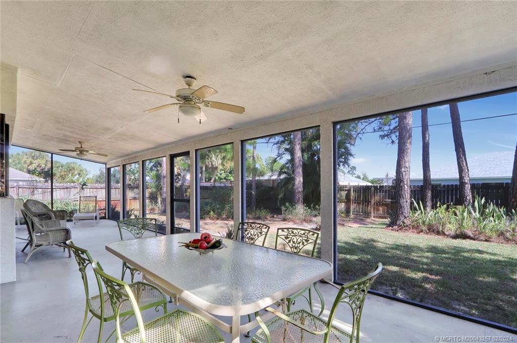 952 Southwest Commonwealth Road Port St. Lucie, FL 34953 - Photo 23 of 33 a view of a dining room with furniture large windows and wooden floor
