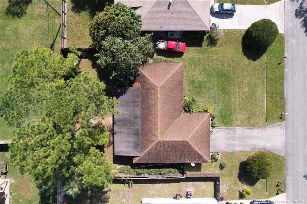 952 Southwest Commonwealth Road Port St. Lucie, FL 34953 - Photo 3 of 33 an aerial view of a house with yard