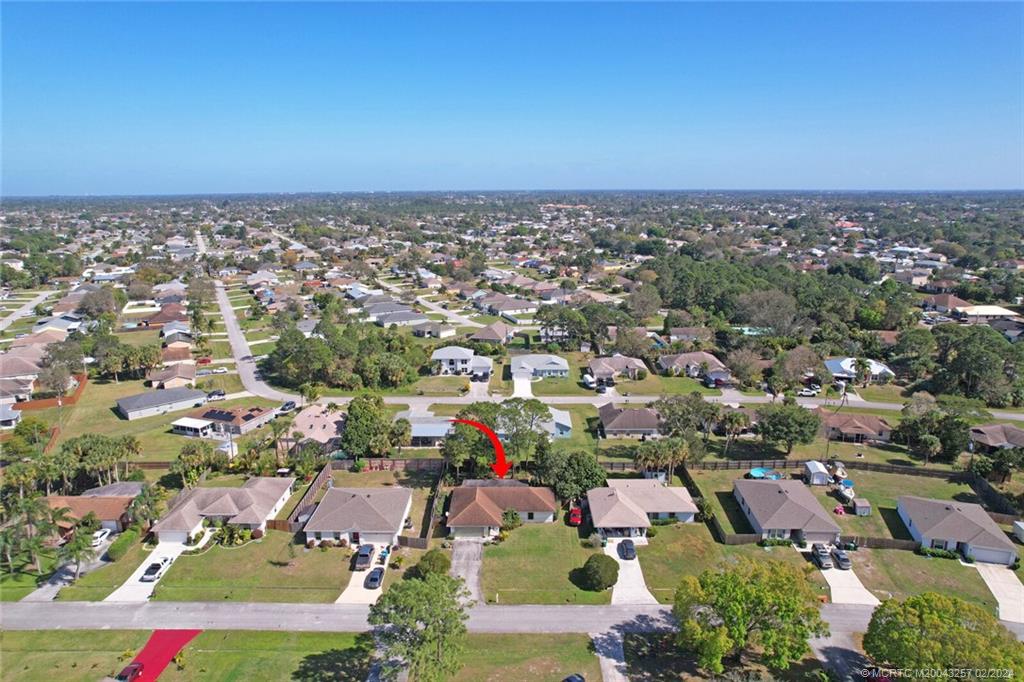 952 Southwest Commonwealth Road Port St. Lucie, FL 34953 - Photo 32 of 33 an aerial view of a city with lots of residential buildings