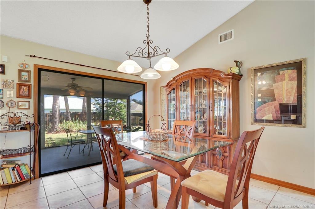952 Southwest Commonwealth Road Port St. Lucie, FL 34953 - Photo 9 of 33 a view of a dining room with furniture window and outside view