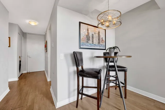 a view of a room with breakfast area and chandelier