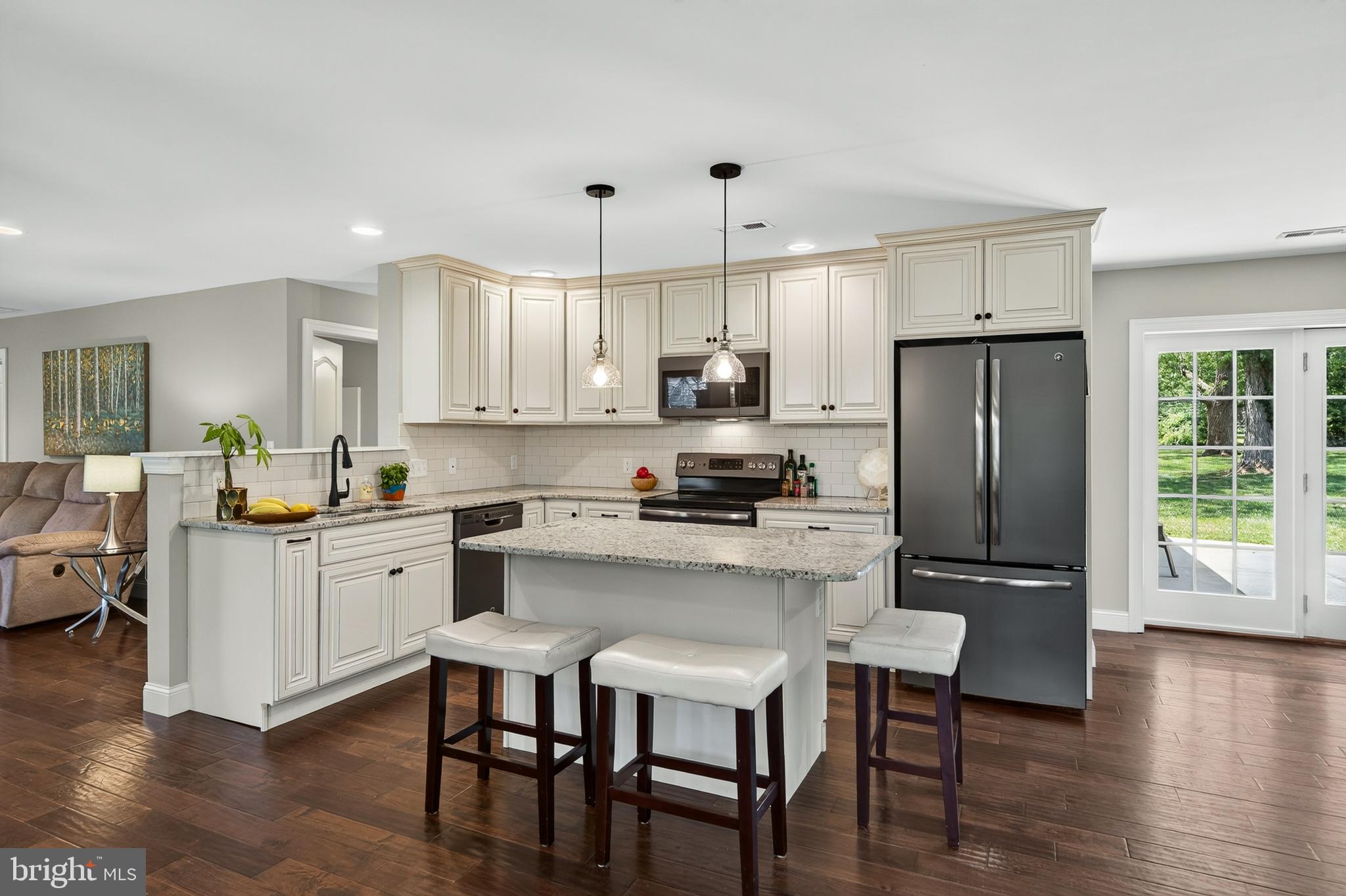 246 Oak Park Road Hatfield, PA 19440 - Photo 6 of 45 a kitchen with white cabinets and stainless steel appliances