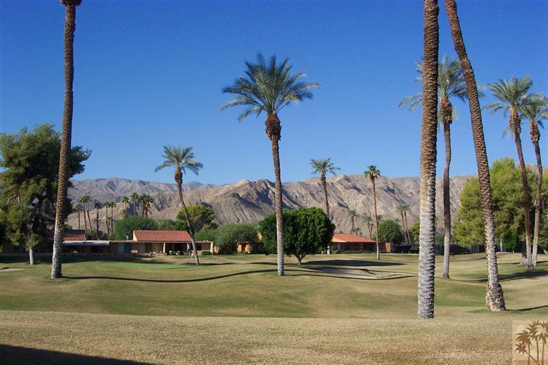 66 La Ronda Drive Rancho Mirage, CA 92270 - Photo 2 of 8 a view of a palm trees next to a yard