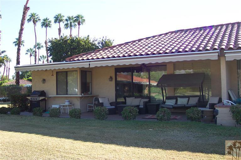 66 La Ronda Drive Rancho Mirage, CA 92270 - Photo 7 of 8 a front view of a house with a garden