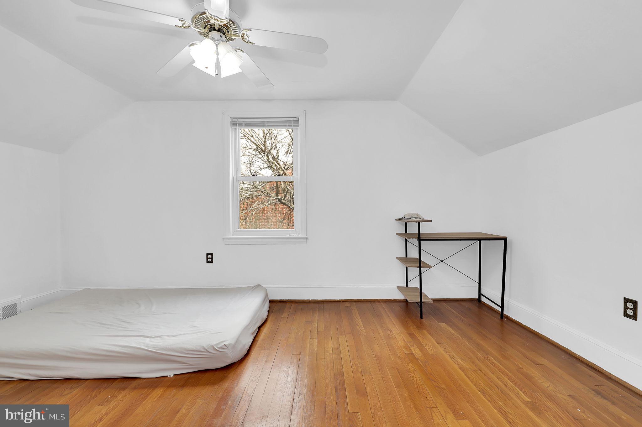 404 Biggs Avenue Frederick, MD 21702 - Photo 12 of 47 wooden floor in an empty room with a window