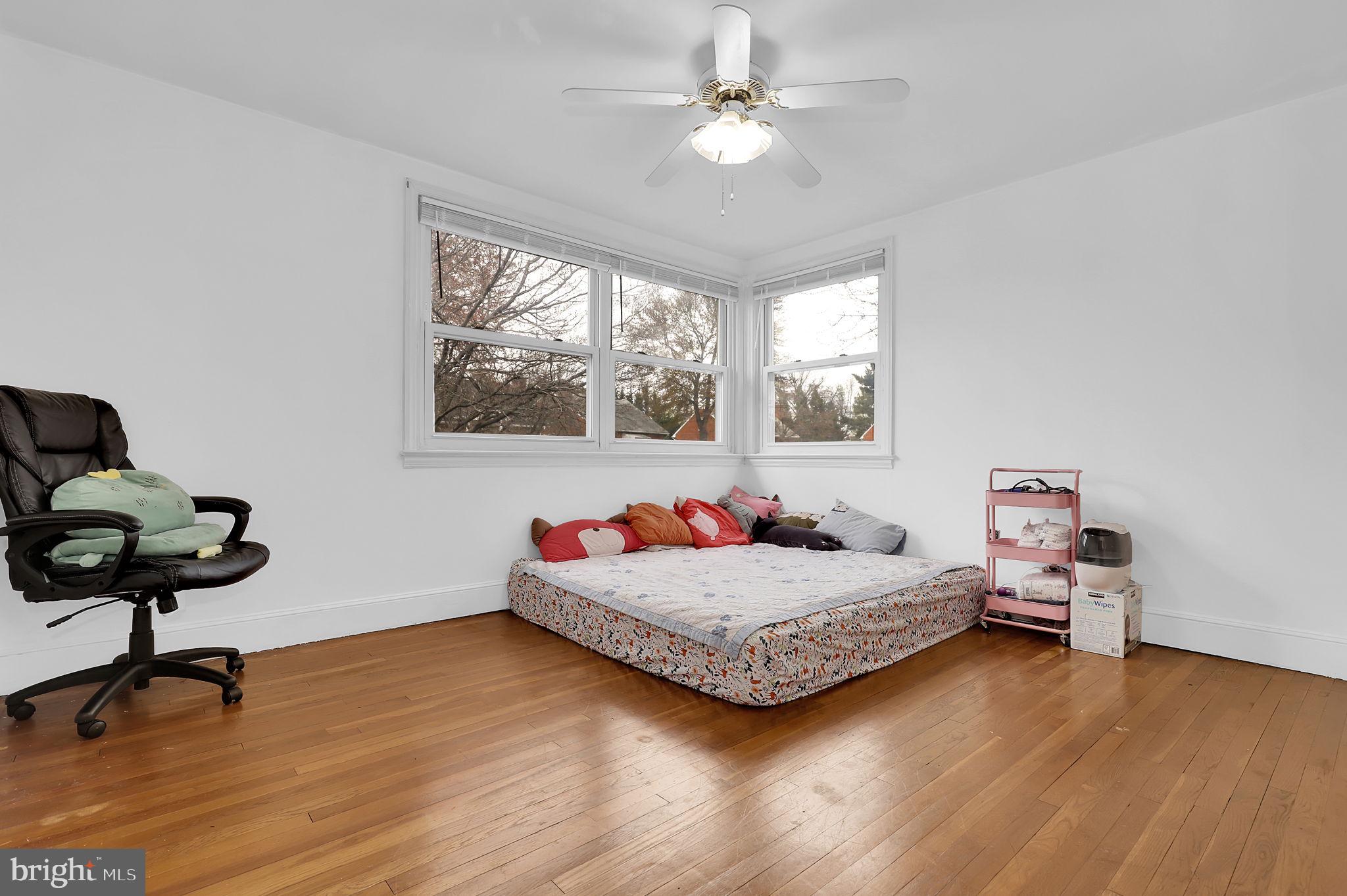 404 Biggs Avenue Frederick, MD 21702 - Photo 17 of 47 a bedroom with furniture and a window