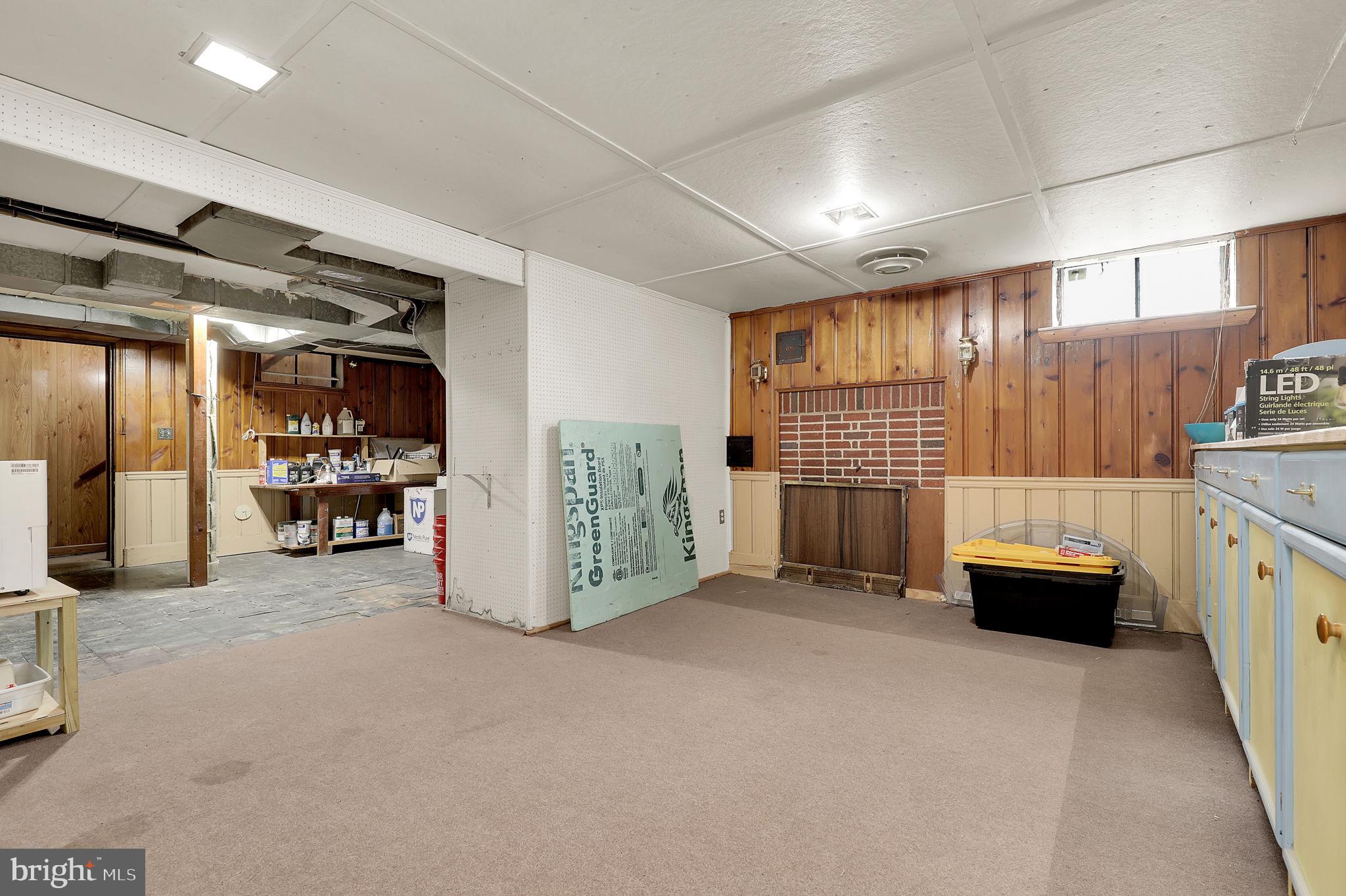 404 Biggs Avenue Frederick, MD 21702 - Photo 20 of 47 a view of an empty room with furniture and a garage