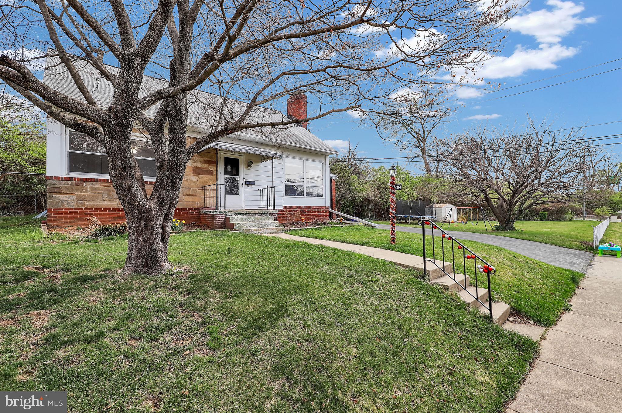 404 Biggs Avenue Frederick, MD 21702 - Photo 24 of 47 a front view of house with yard and green space