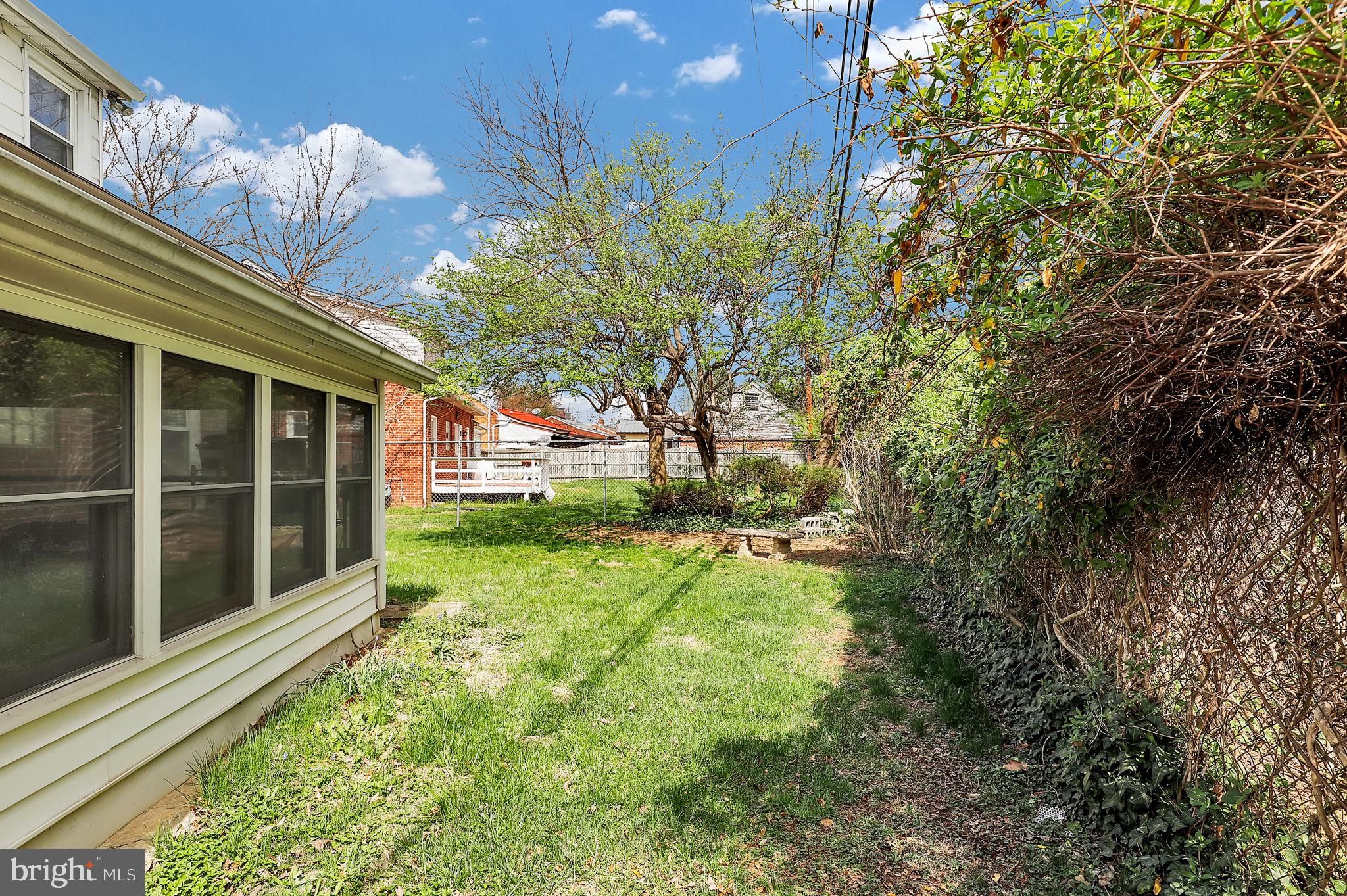 404 Biggs Avenue Frederick, MD 21702 - Photo 28 of 47 a view of a house with backyard and a tree