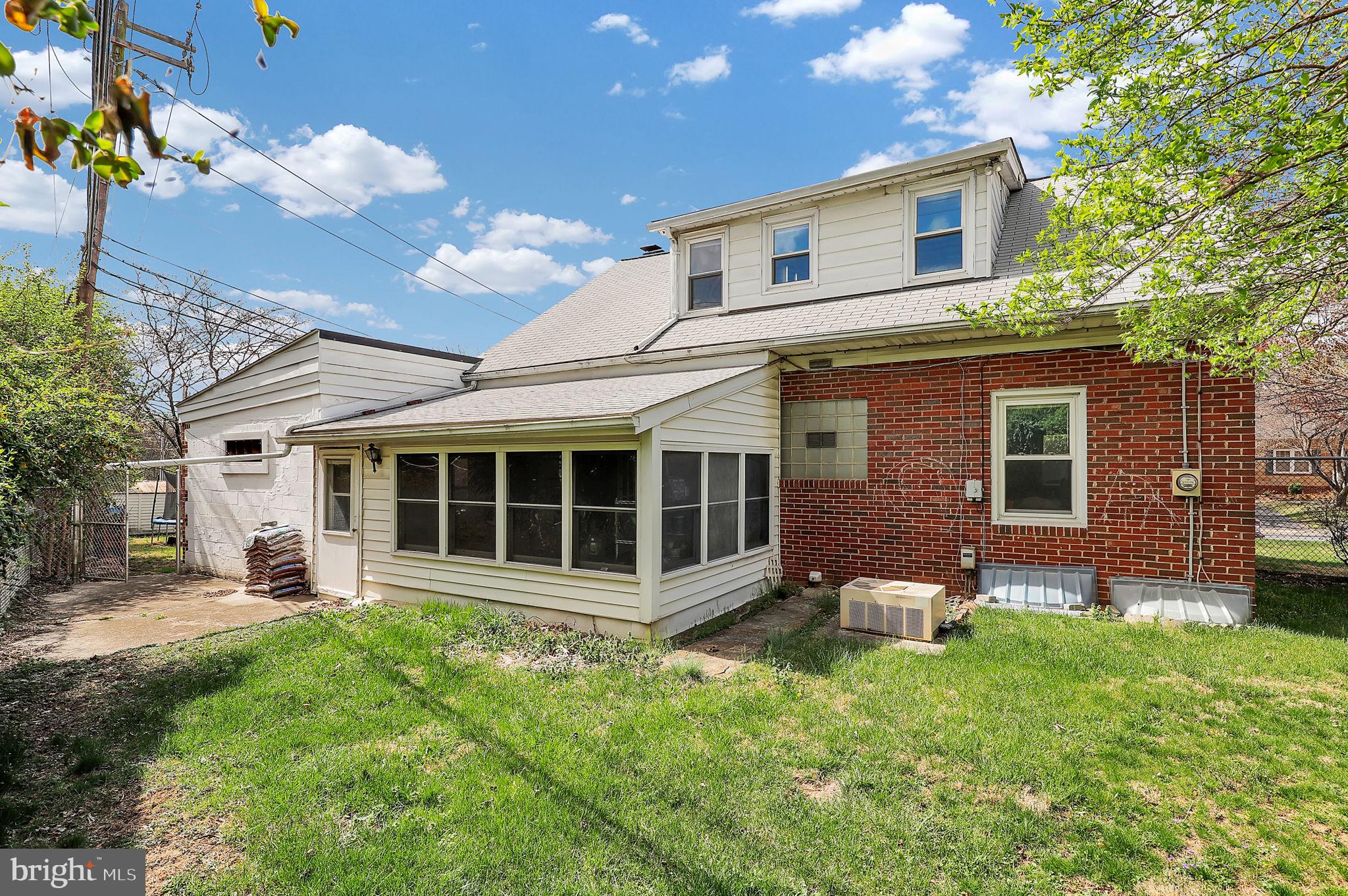 404 Biggs Avenue Frederick, MD 21702 - Photo 30 of 47 a backyard of a house with yard and outdoor seating