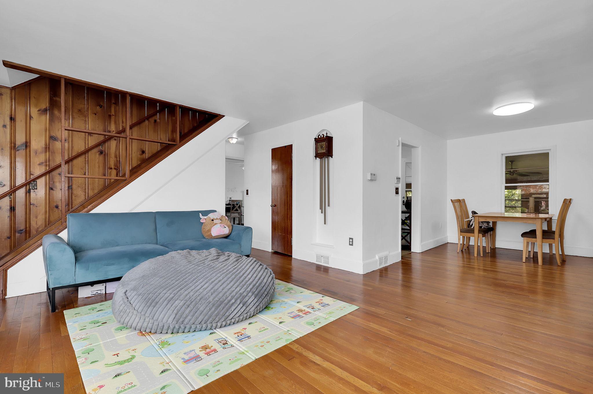 404 Biggs Avenue Frederick, MD 21702 - Photo 4 of 47 a living room with furniture and wooden floor