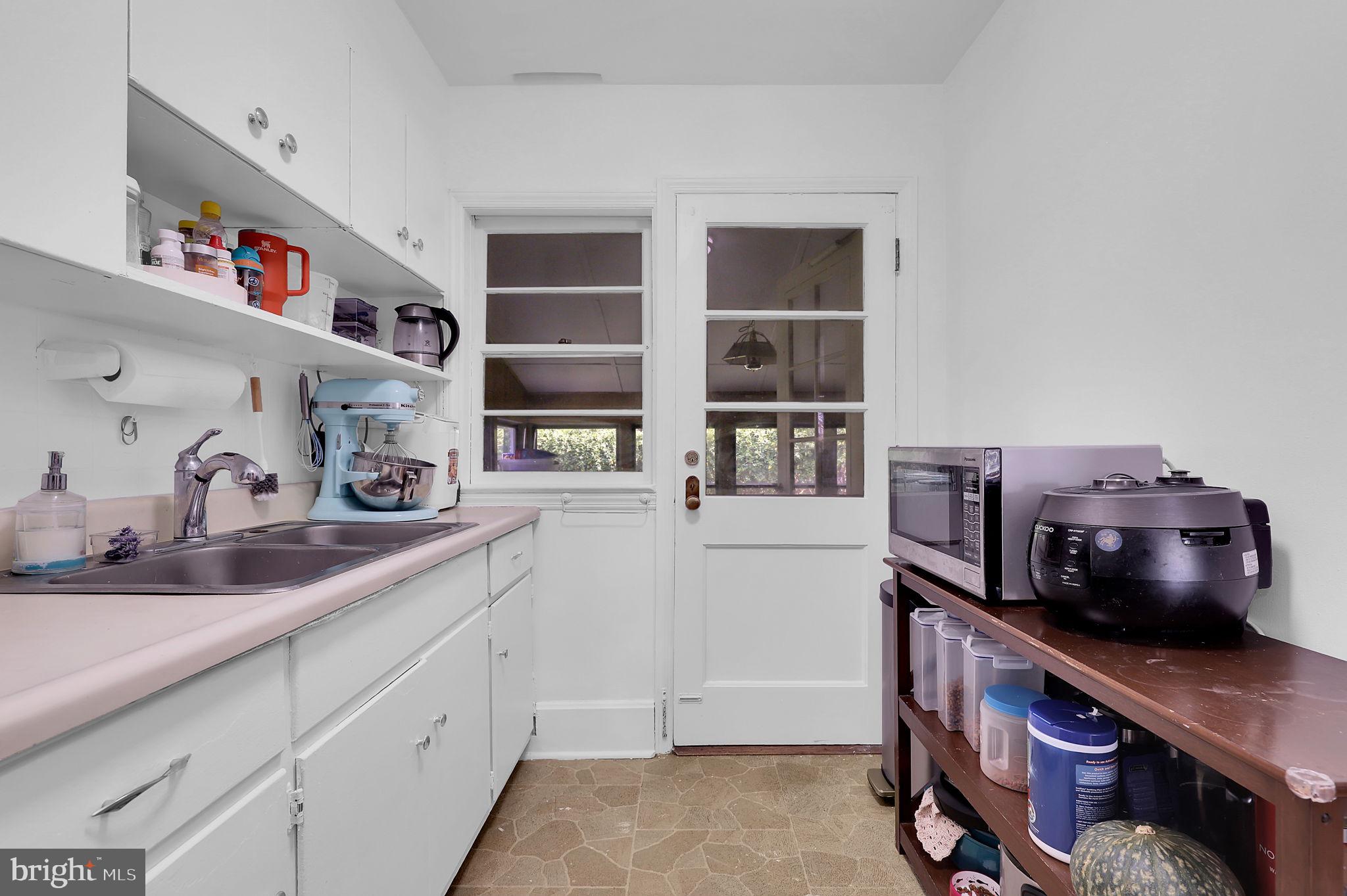 404 Biggs Avenue Frederick, MD 21702 - Photo 9 of 47 a kitchen with stainless steel appliances a cabinets and wooden floor