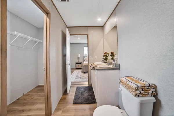 a bathroom with a shower and a glass door