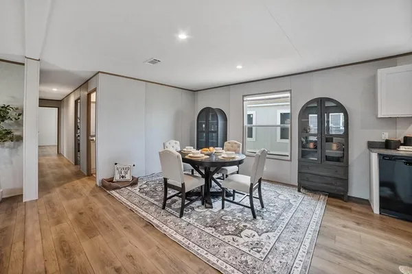a view of a livingroom with furniture and wooden floor