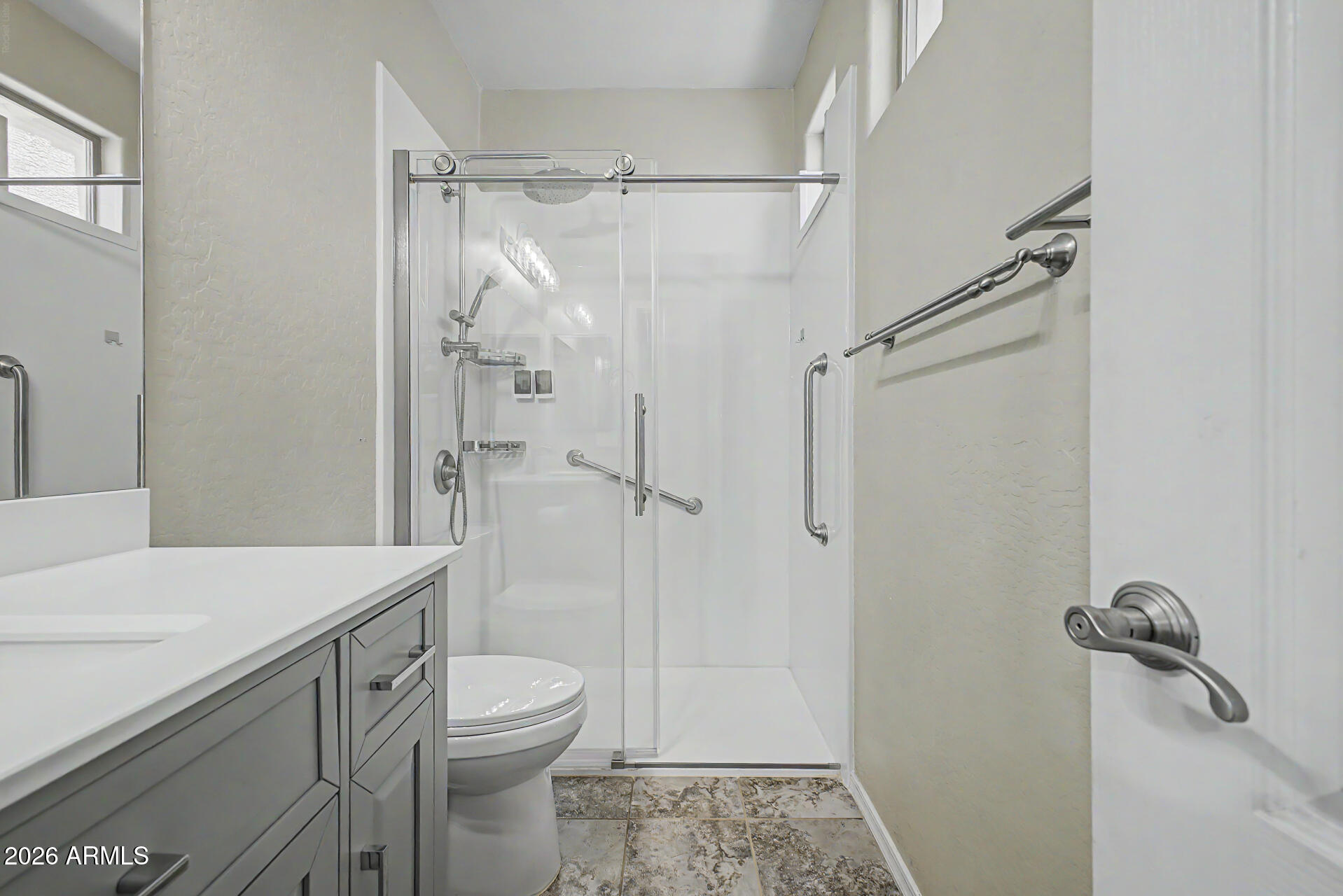 2600 East Springfield Place, Unit 109 Chandler, AZ 85286 - Photo 17 of 38 a bathroom with a granite countertop sink toilet and shower