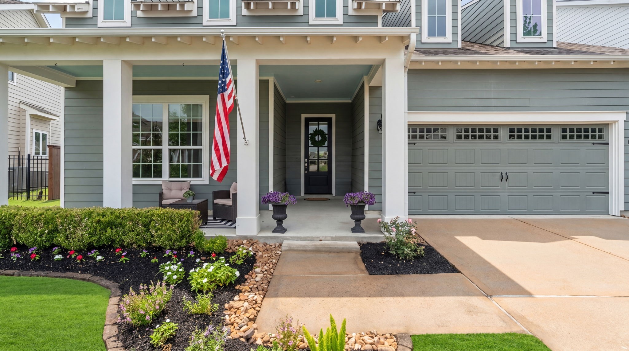 2206 Rope Maker Road Conroe, TX 77384 - Photo 4 of 42 Wide covered entry with classic architectural details and a warm, custom-inspired feel.