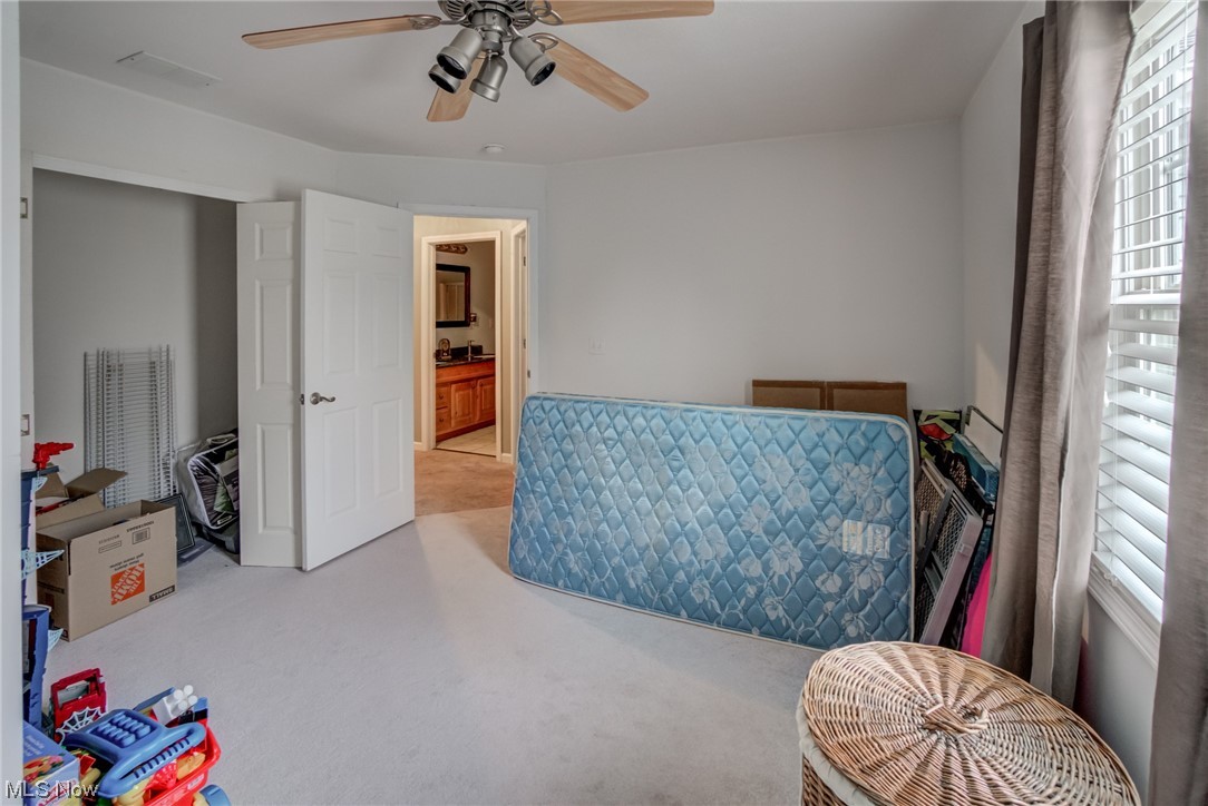 171 Nobottom Road Berea, OH 44017 - Photo 22 of 30 Bedroom with light carpet, ensuite bathroom, and ceiling fan