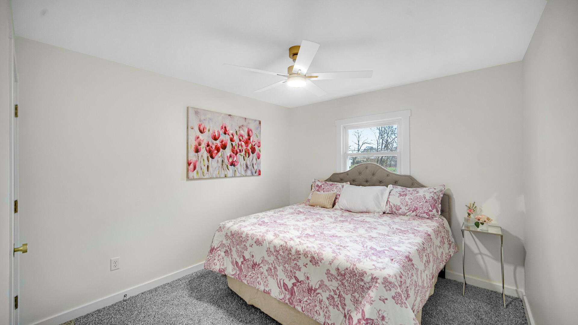 1330 Idaho Street Gary, IN 46403 - Photo 15 of 23 a bedroom with a large bed and a chandelier