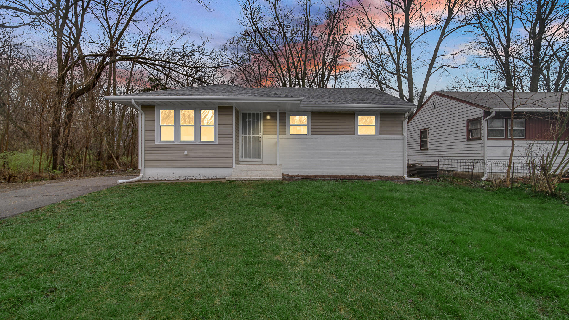 1330 Idaho Street Gary, IN 46403 - Photo 2 of 23 a front view of a house with a garden