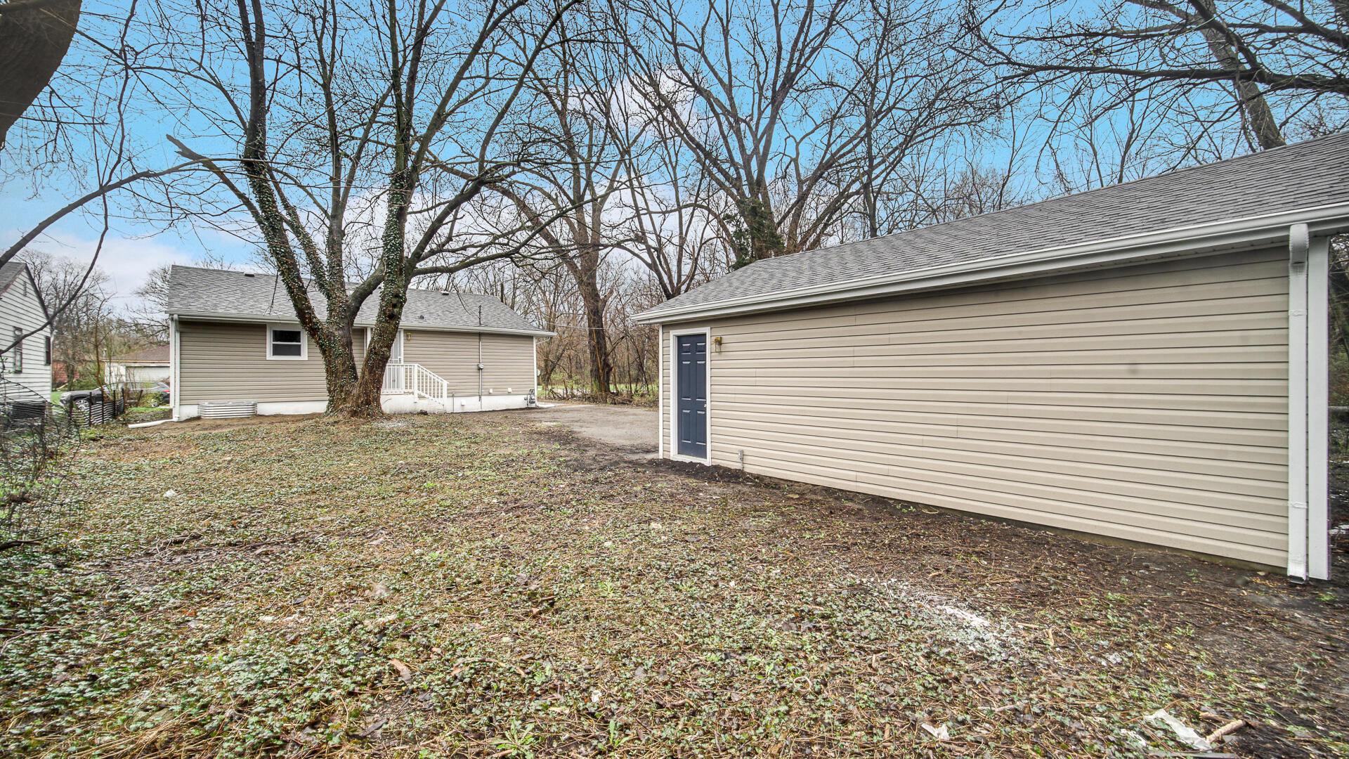 1330 Idaho Street Gary, IN 46403 - Photo 22 of 23 a view of a backyard with large trees